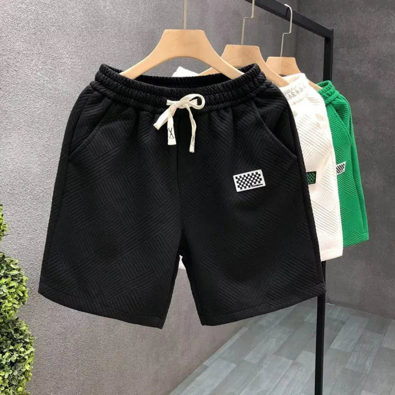 Men's casual polyester sports shorts in solid colours with micro-elastic fabric for beach and sports activities