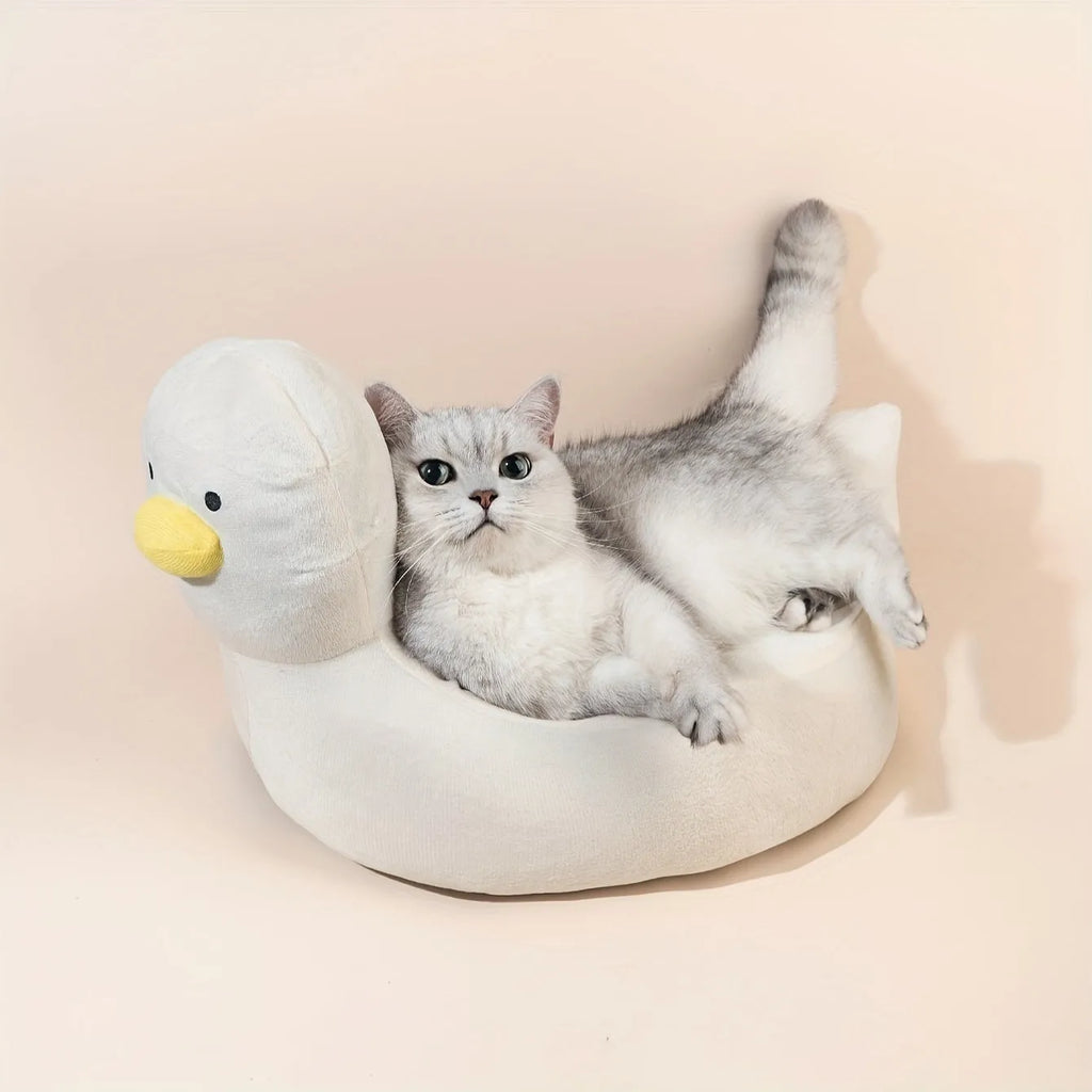 Blue duck-shaped fluffy pet sofa bed for small dogs and cats on a white background.