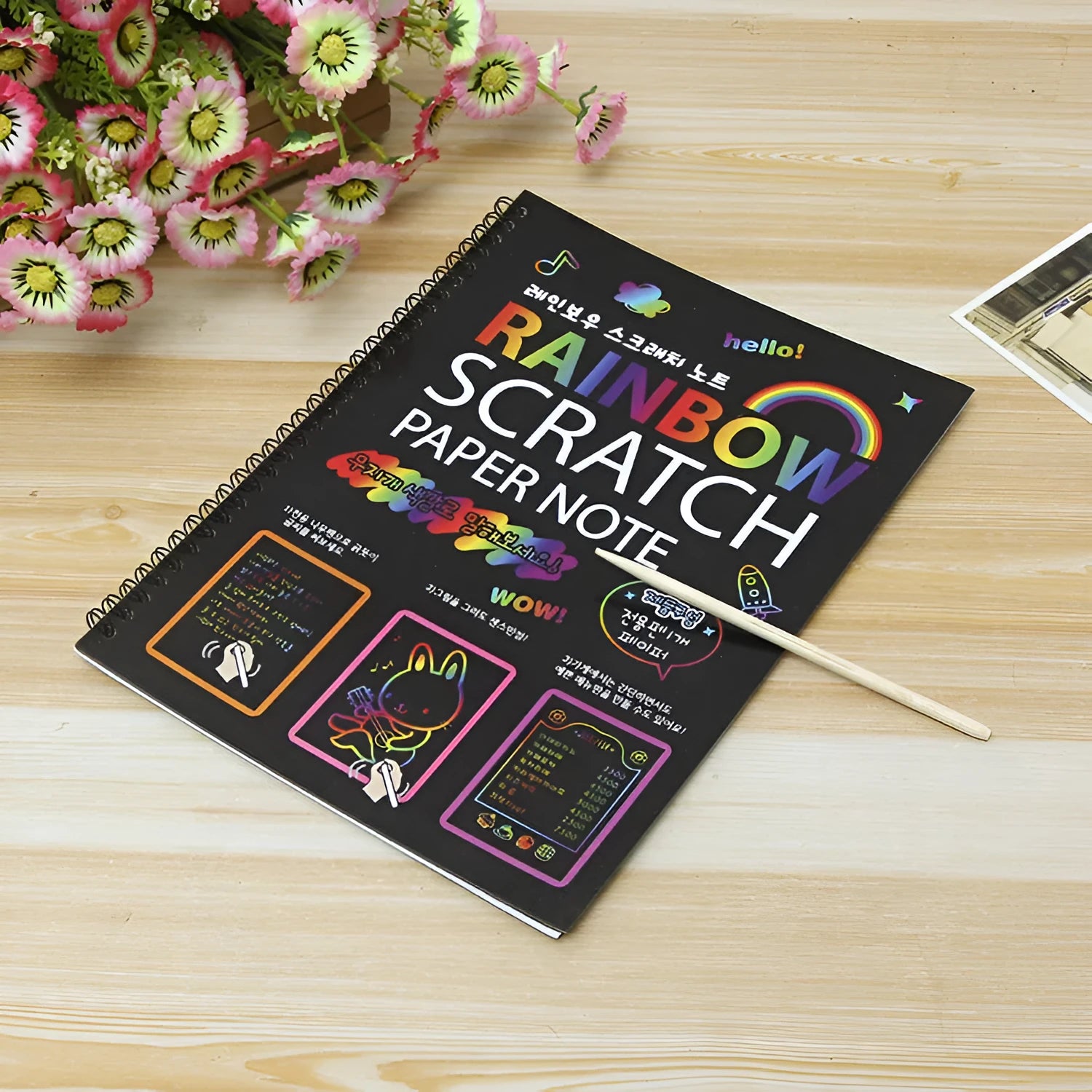 Large children's scratch art paper with colourful design revealed through scraping