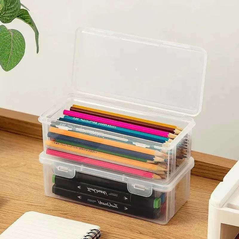 Clear plastic large capacity pencil storage box filled with coloured pencils and art supplies