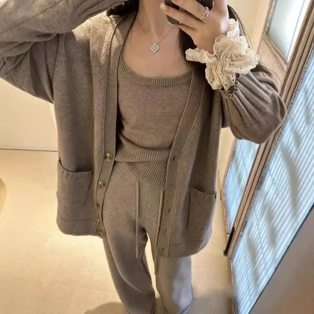 Women's loose fit wool blend cardigan three-piece set in beige, showing vest, coat, and casual pants.