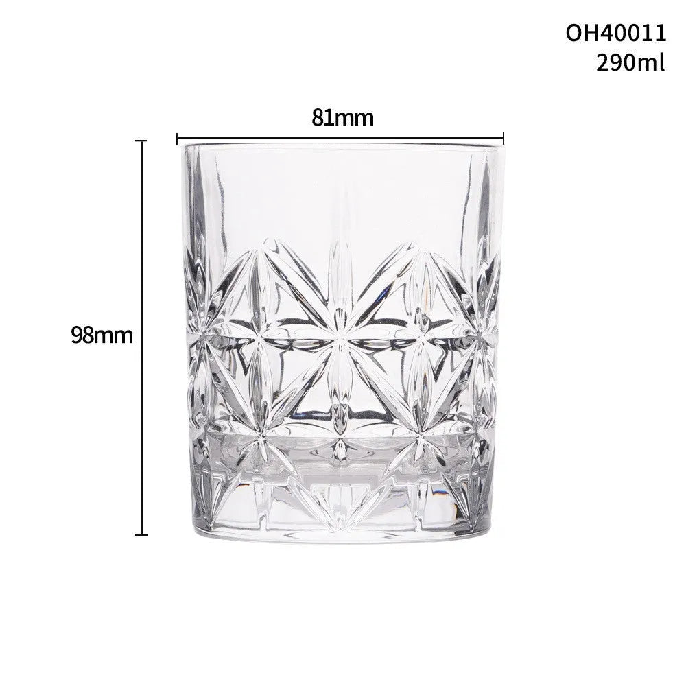 Clear thick-bottom whiskey shot glass with 301-400ml capacity on a table.