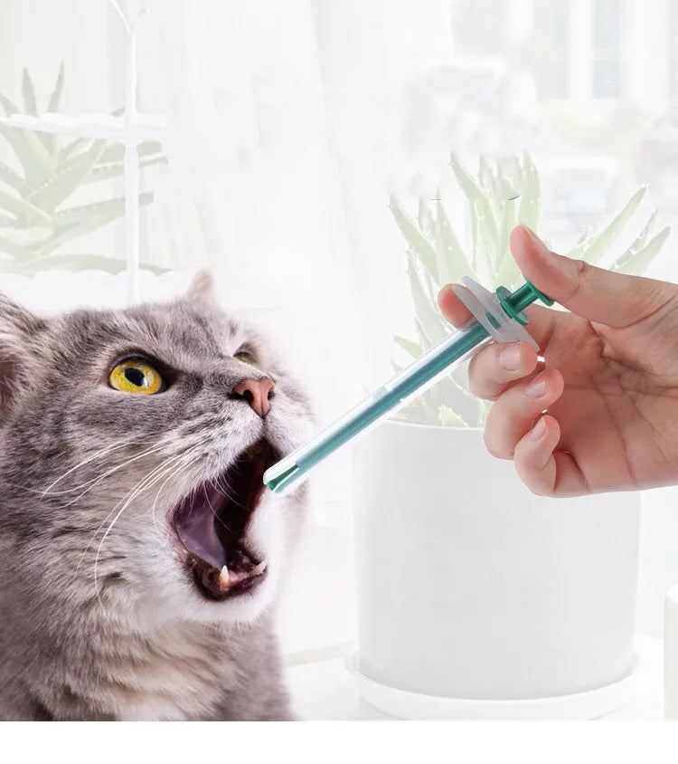 Two silicone pet pill shooter syringes, one 15cm and one 11.5cm, for feeding medication to cats and dogs.