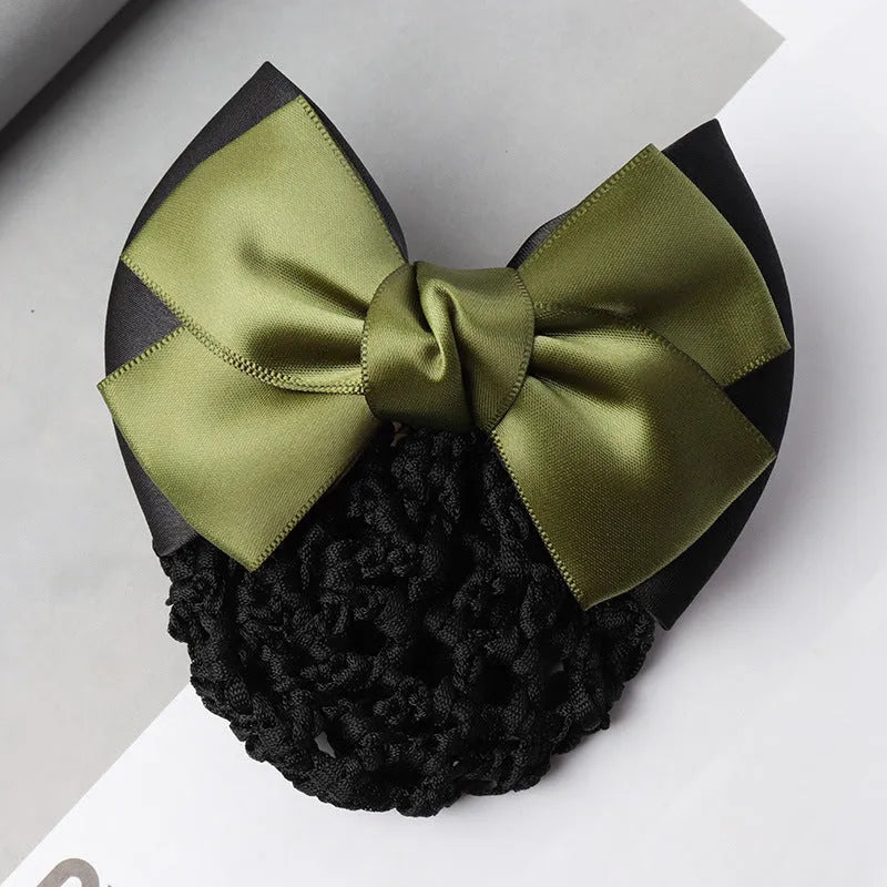 Professional hair clip with a black net pocket and a red flower bow ornament on a white background.