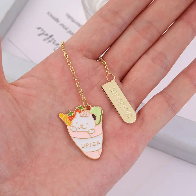 Metal bookmark with cartoon cat pendant in one of four designs measuring 3.8cm by 18.3cm