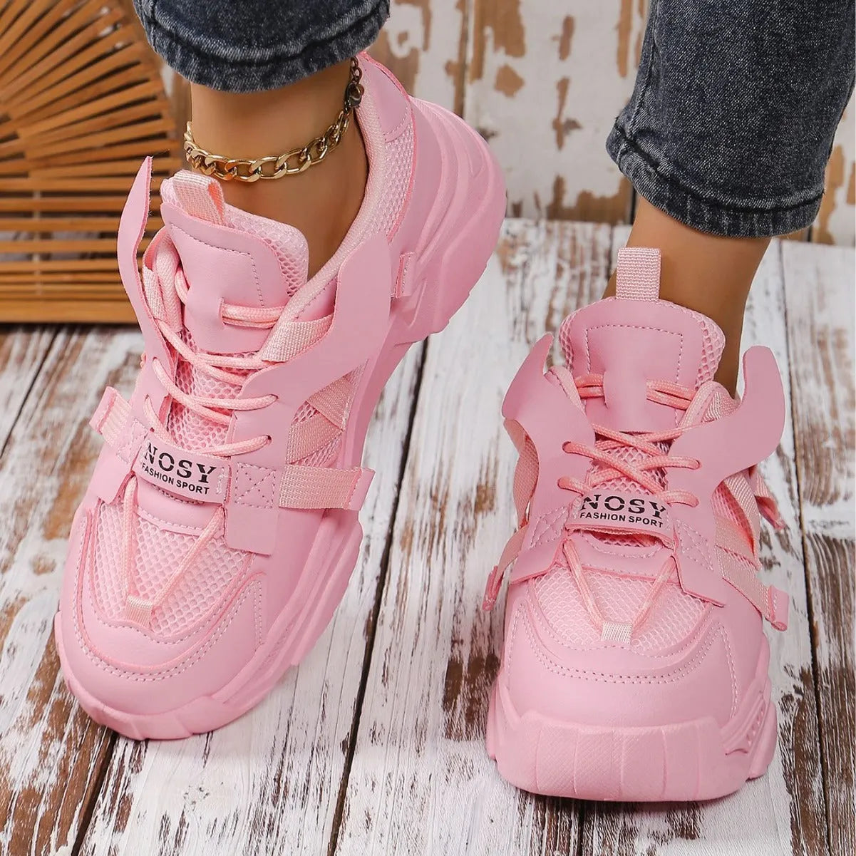 Women's purple platform mesh sports sneakers with animal pattern and lace-up front.