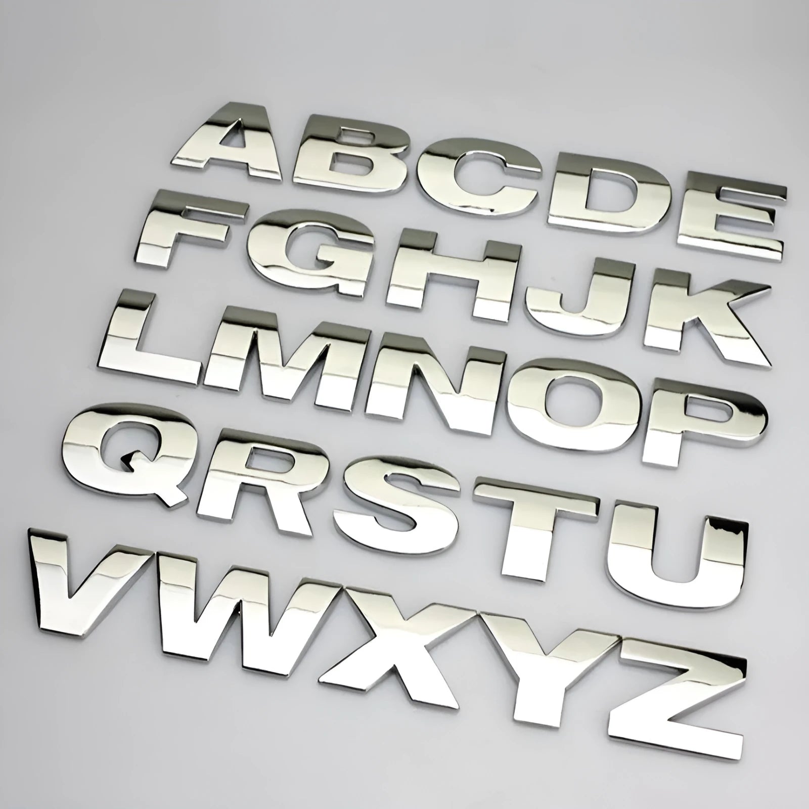 Zinc alloy 3D car bumper stickers showing individual metal letters approximately 2.5cm tall in black and silver finishes