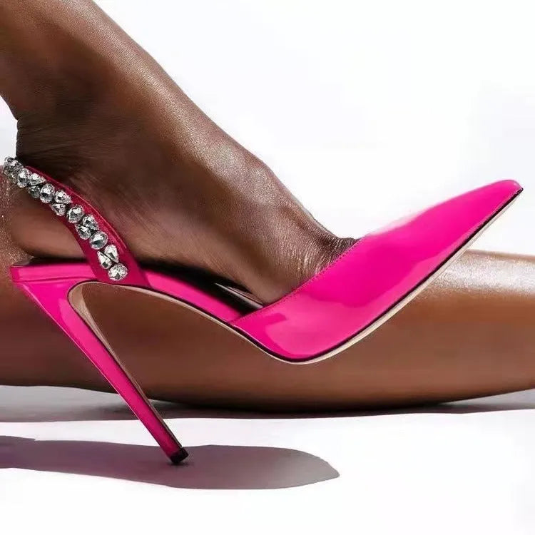 Women's black patent leather rhinestone high heel sandals with pointed toe and ankle strap.