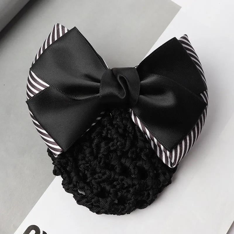 Professional hair clip with a black net pocket and a red flower bow ornament on a white background.