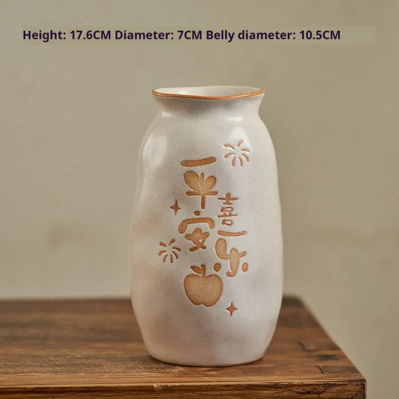 Chinese hand-painted ceramic vase with persimmon fruit designs on wooden desktop