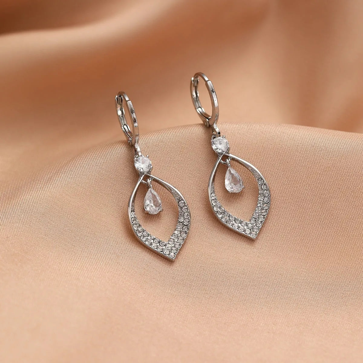 Copper electroplated women's earrings with water drop tassel design and gold or silver buckles