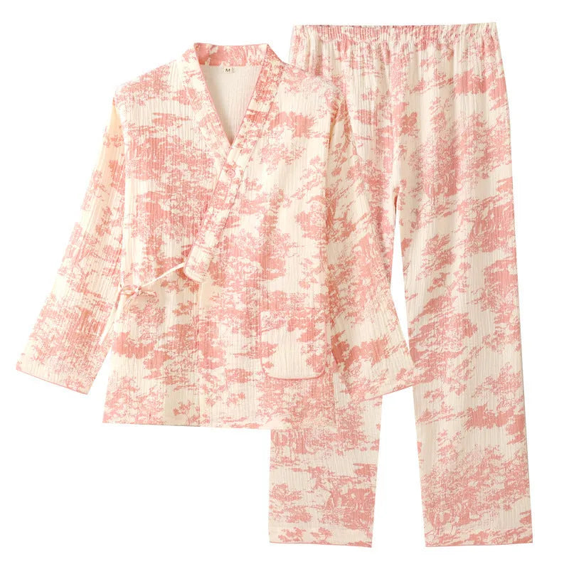 Women's pink pure cotton gauze long sleeve lounge suit top and trousers on a hanger.