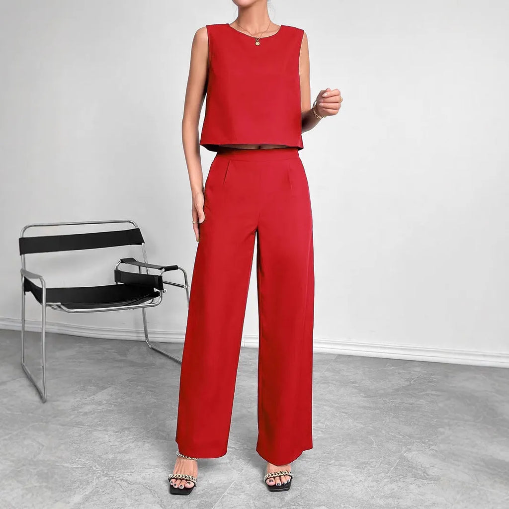 Women's red polyester two-piece set with sleeveless top and wide leg trousers displayed flat