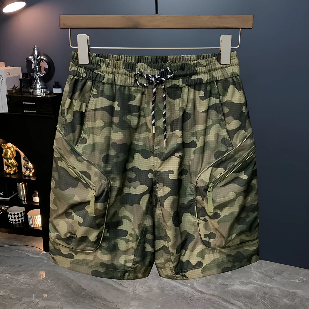 Man wearing loose fit camouflage cargo shorts made from quick-drying cotton blend fabric.