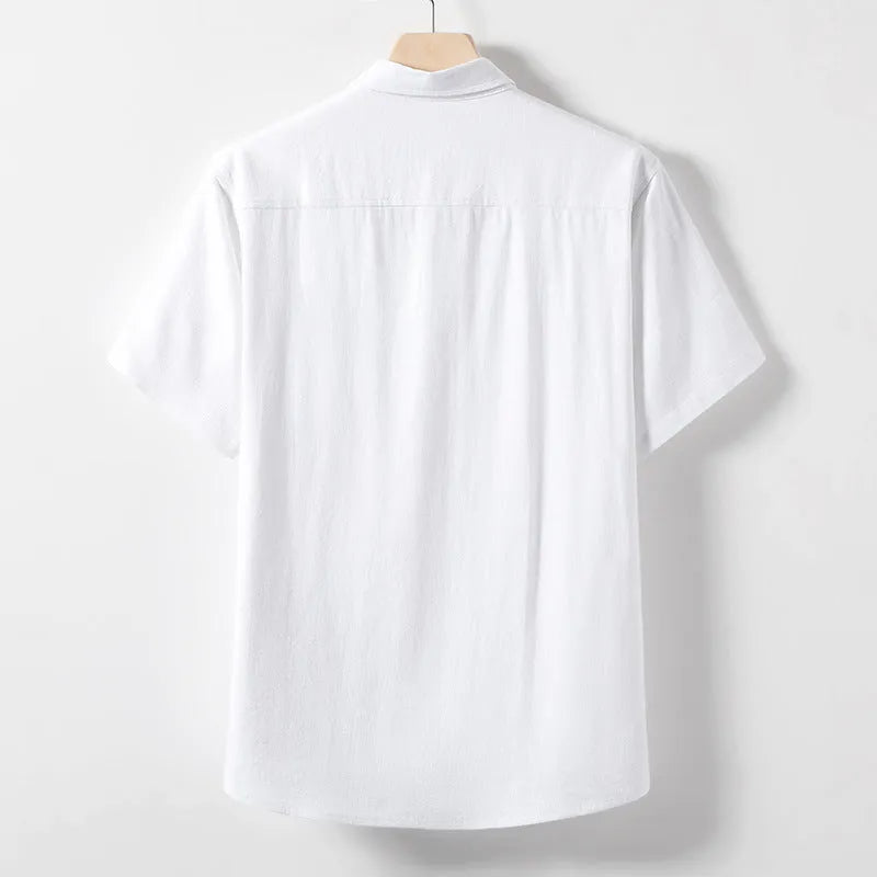 Man's loose-fit linen blend T-shirt in black, shown in a casual setting.