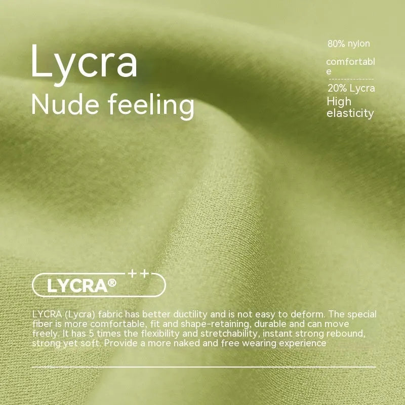 Women's high-waisted Lycra yoga shorts in leaf green, showing anti-exposure construction and short length.