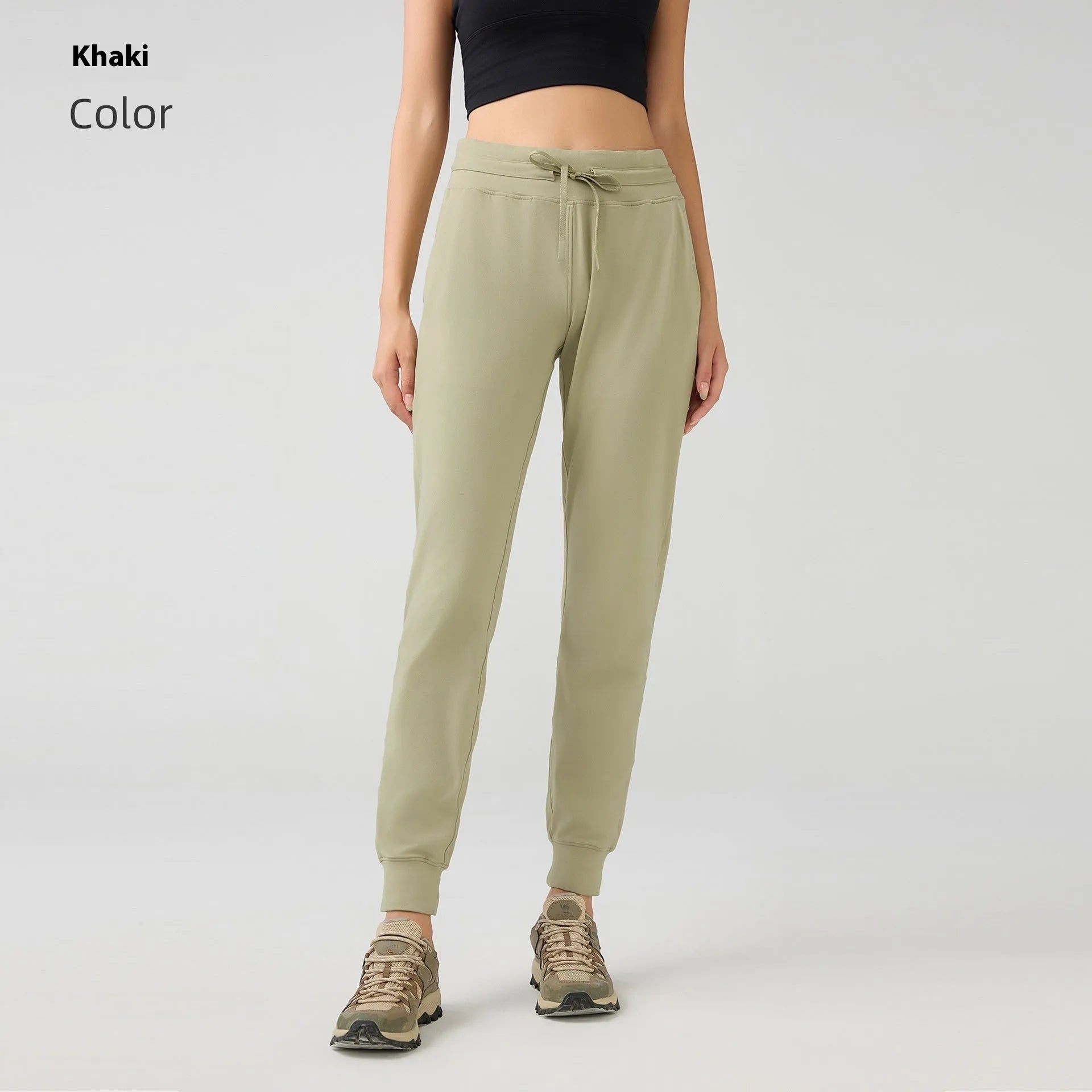 Women's high-waist yoga pants with drawstring waistband in distilled coffee colour, suitable for fitness.
