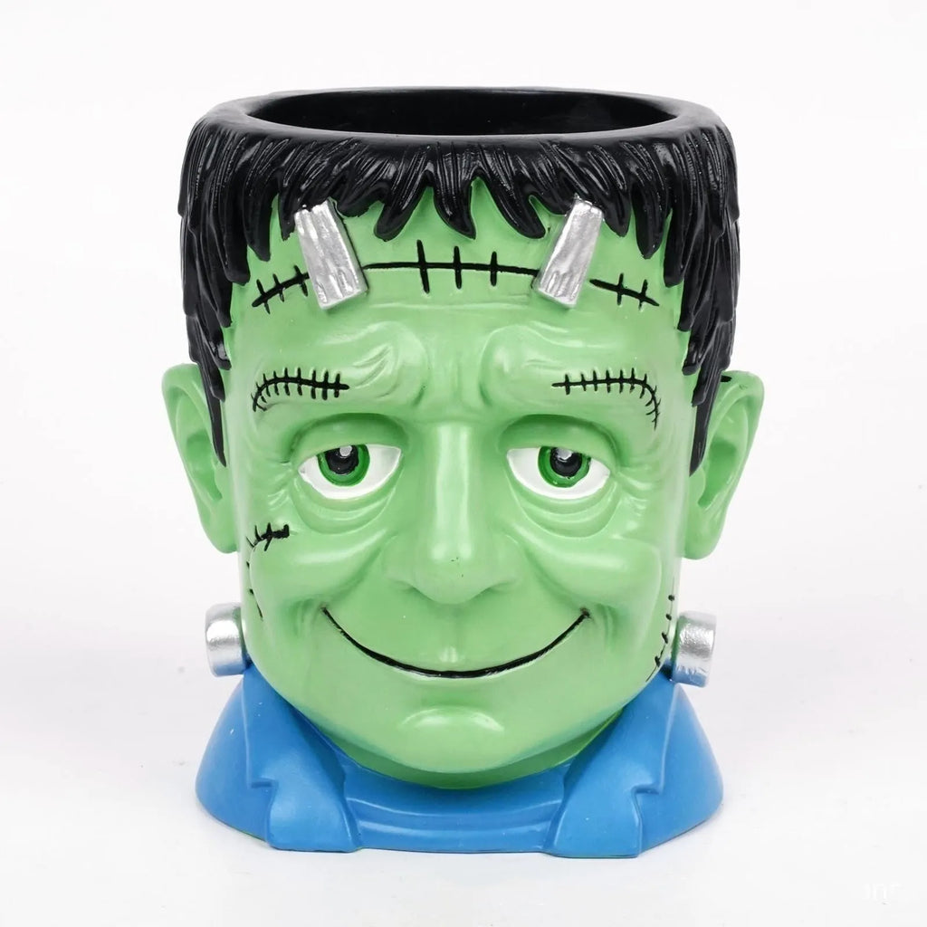 Four Halloween cartoon character resin flower pot decorations with hand-painted details