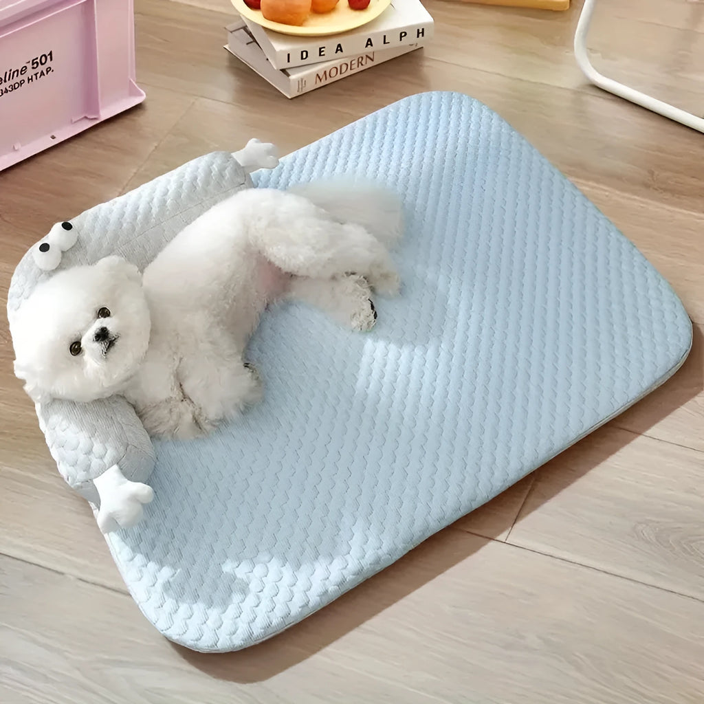 Blue pet cooling bed with large-eye monster design on non-slip polyester mat for dogs and cats