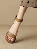 Women's white retro platform high heels with an ankle strap and round toe.