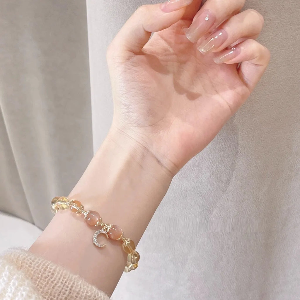 Chinese style crystal bracelet with 14K electroplated gilding and diamond-shaped citrine moon coloured elements