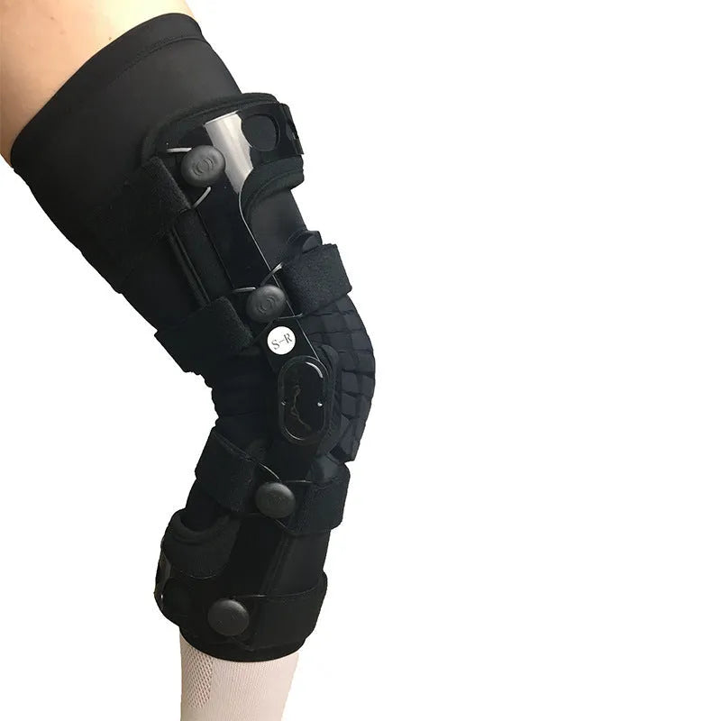 Black anterior ligament knee supporter showing sponge padding and brushed cloth lining, with size tags for left and right legs.