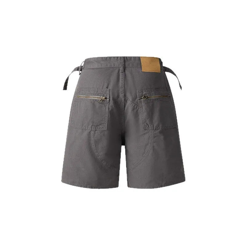 Grey retro-style workwear shorts made from soft washed cotton cloth, featuring a zipper and loose fit.