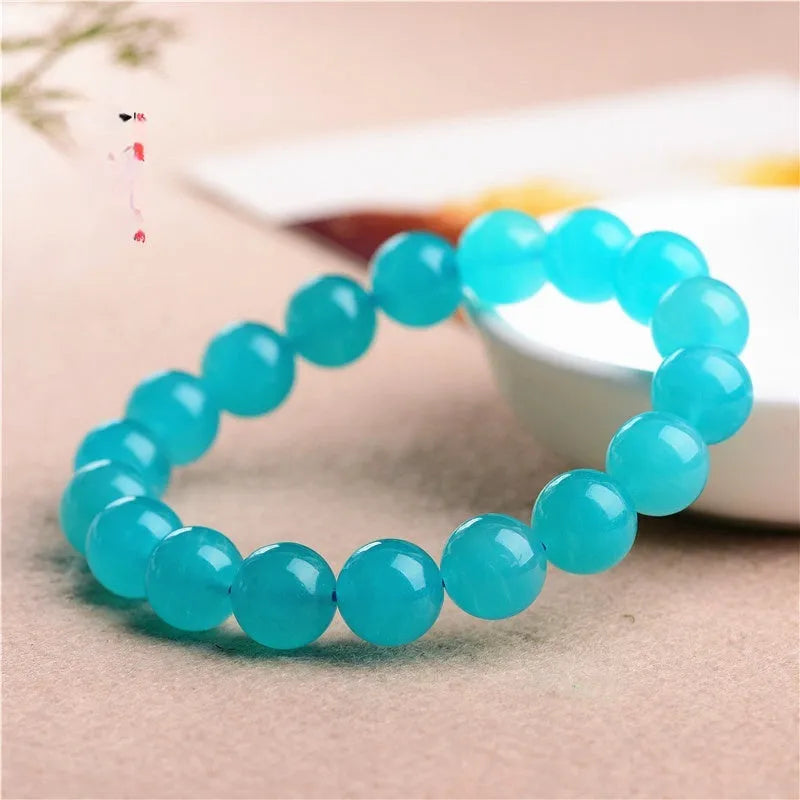 Natural 7A grade ice blue amazonite beads on a string, showing polished surfaces and varying sizes.
