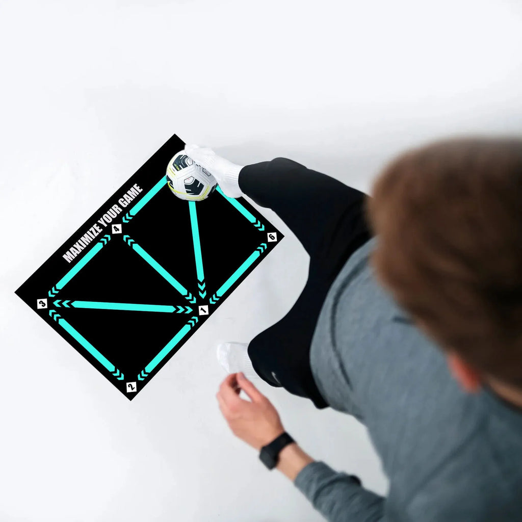 Black football training mat measuring 60 by 90 centimetres with non-slip surface