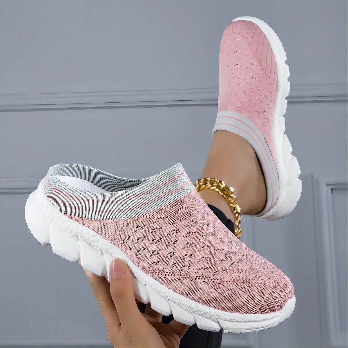 Women's black Flyknit semi slippers with hollowed-out sewing line detail and viscose sole