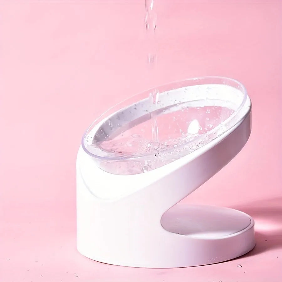 Clear plastic tilted cat food dish on a 7cm tall white plastic elevated base.