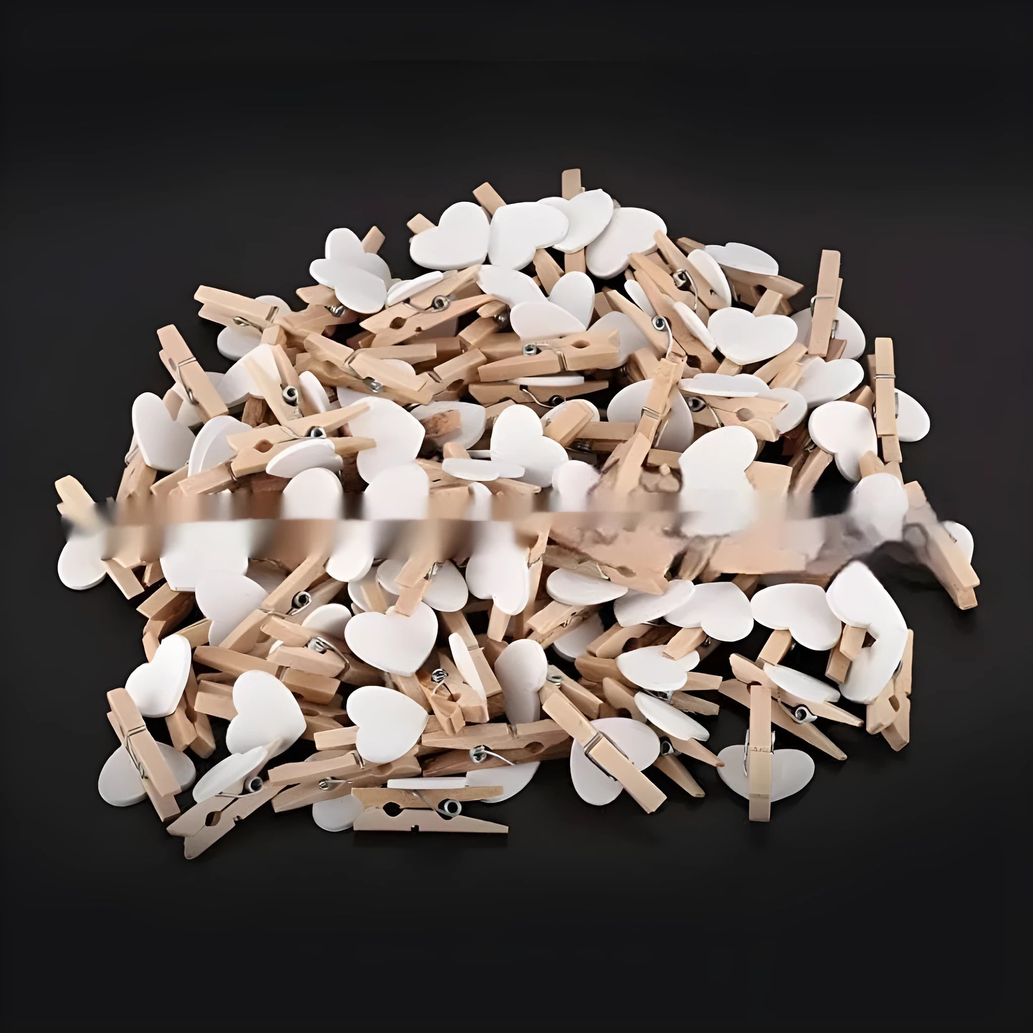 Five solid wood heart-shaped clips in different colours showing handmade construction details