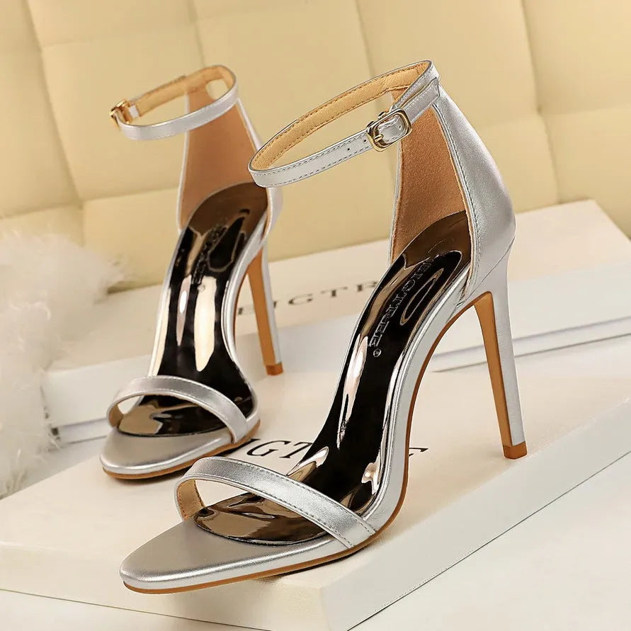 Open toe ankle strap high heels in artificial PU leather with buckle fastening