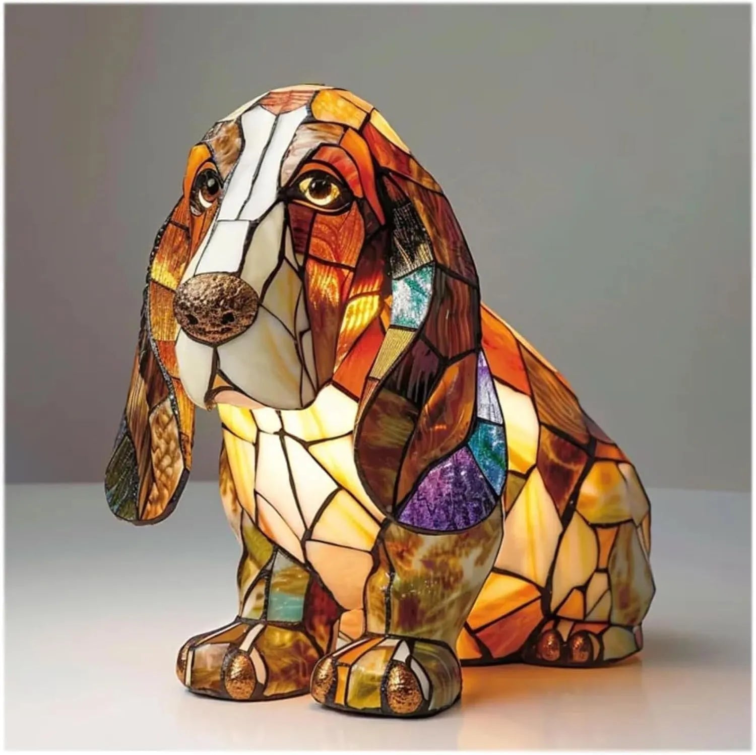 Colourful resin dog lamp decoration in pug shape, button battery powered, on a shelf