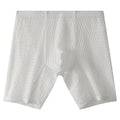 Men's white lace boxer shorts with a mid-waist and lengthened cut on a neutral background.