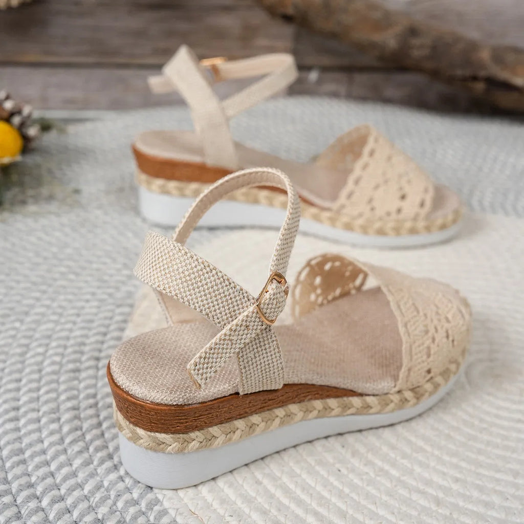 Beige closed toe wedge sandals with buckle fastening and leather upper for women
