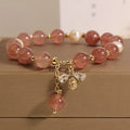 Freshwater pearl and strawberry quartz bracelet with zircon flower charms