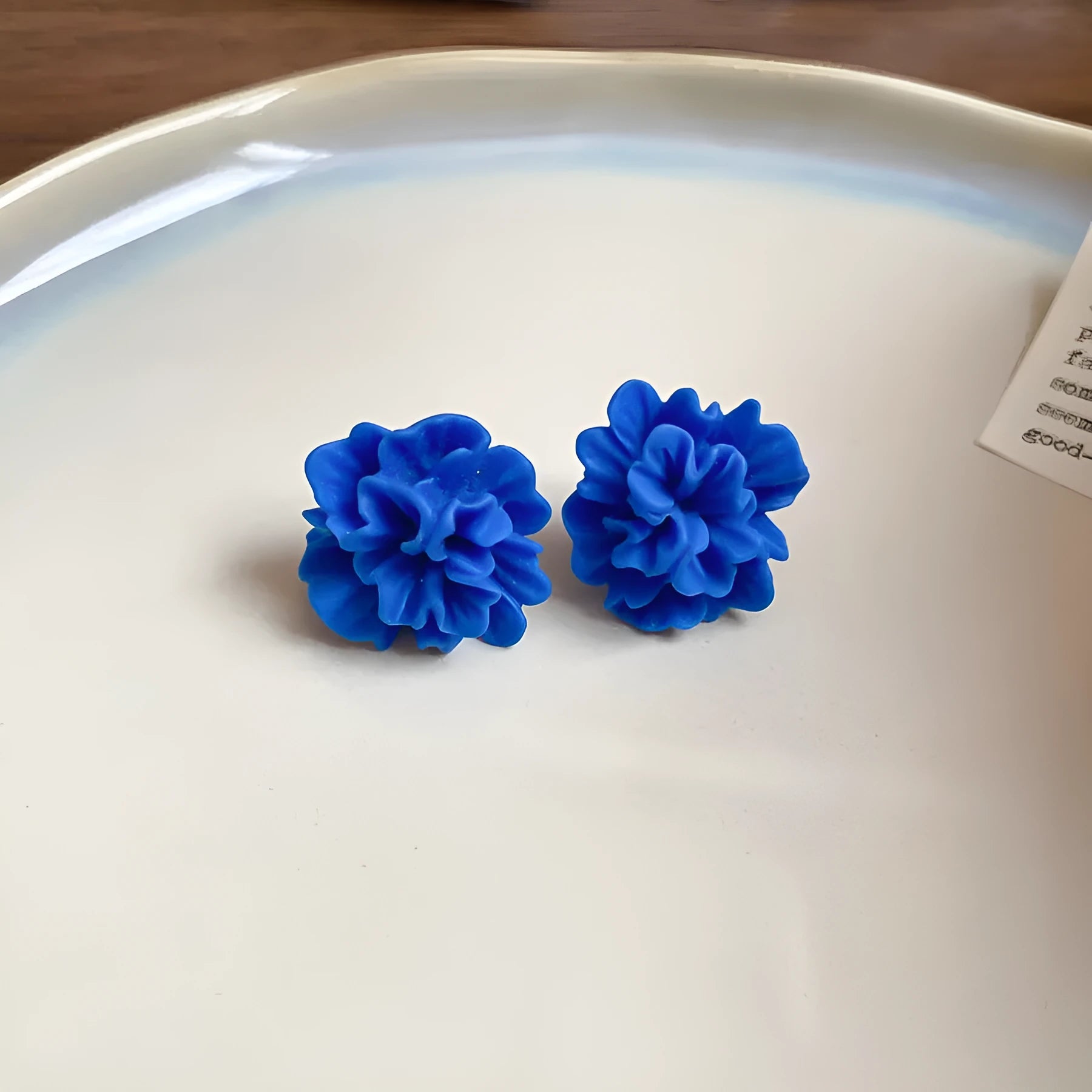 Geometric cloth earrings with silver needle-blue resin flower colour and round design details