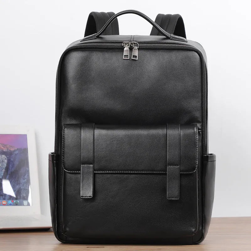 Black genuine leather men's computer backpack with a 36-55L capacity and contoured back plate.