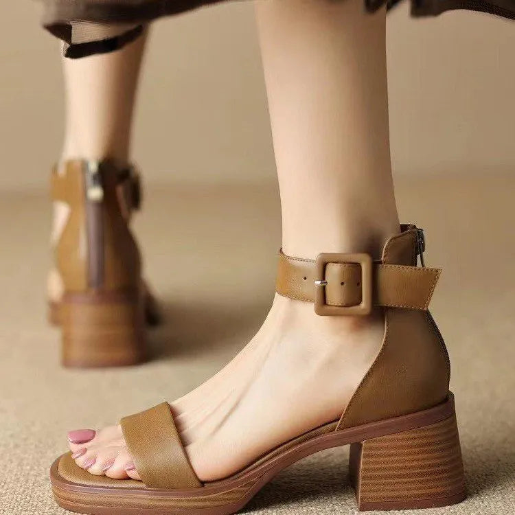 Women's white retro platform high heels with an ankle strap and round toe.