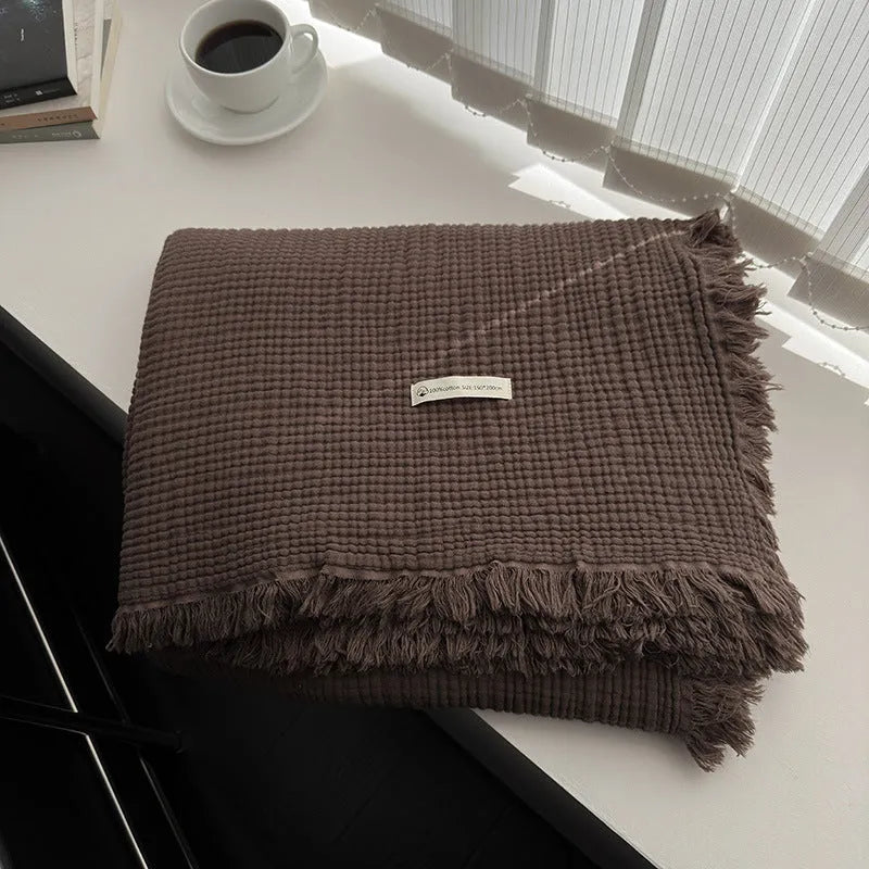 Four-layer gauze cotton blanket with tassel detailing in navy blue colour option