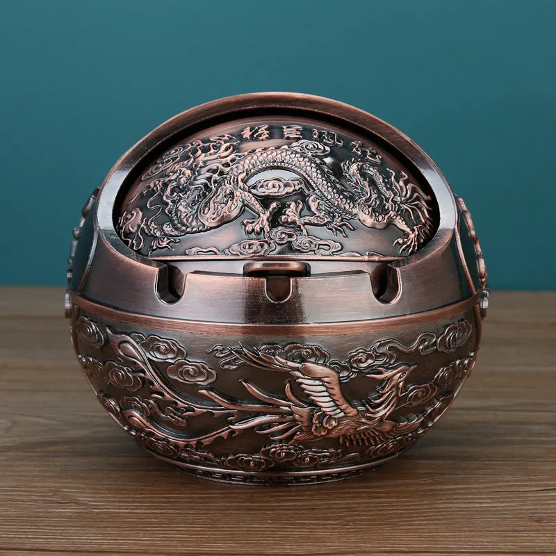 Alloy ashtray with smoke extinguishing slot in bronze finish featuring decorative dragon and phoenix design