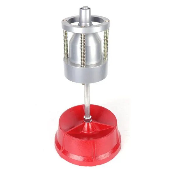 Portable aluminium hub balancer with enamel base for wheel balancing.