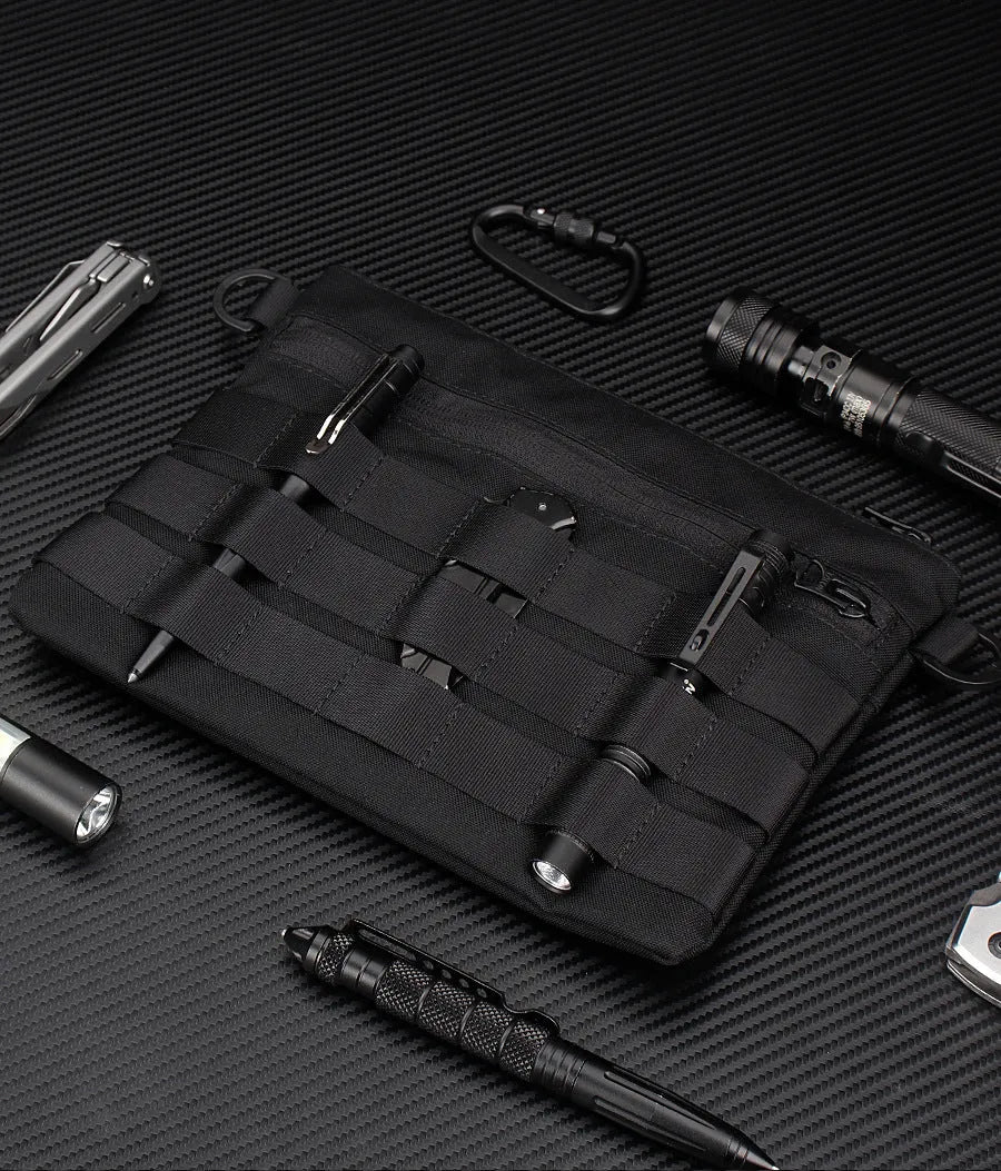 Black Oxford cloth military utility bag measuring 18 by 3.5 centimetres