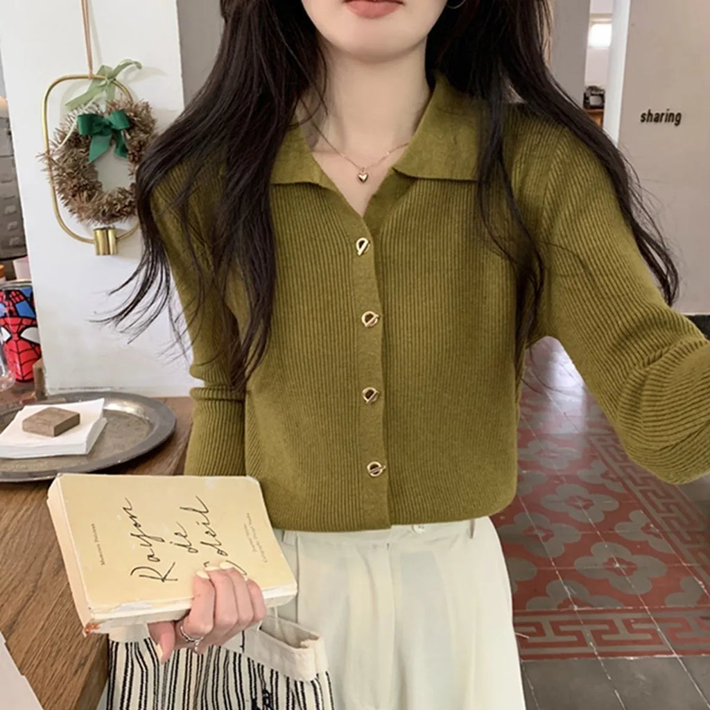 Beige viscose knitted cardigan with long sleeves displayed as bottoming top