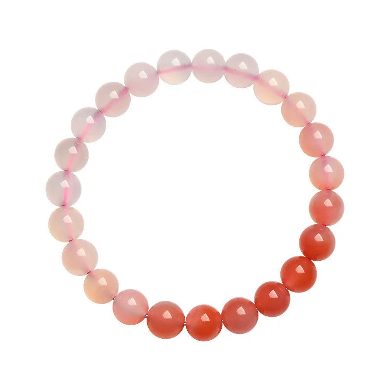 Natural gradient Yanyuan Agate bracelet showing graduated colour on geometrically shaped beads in a single circle.