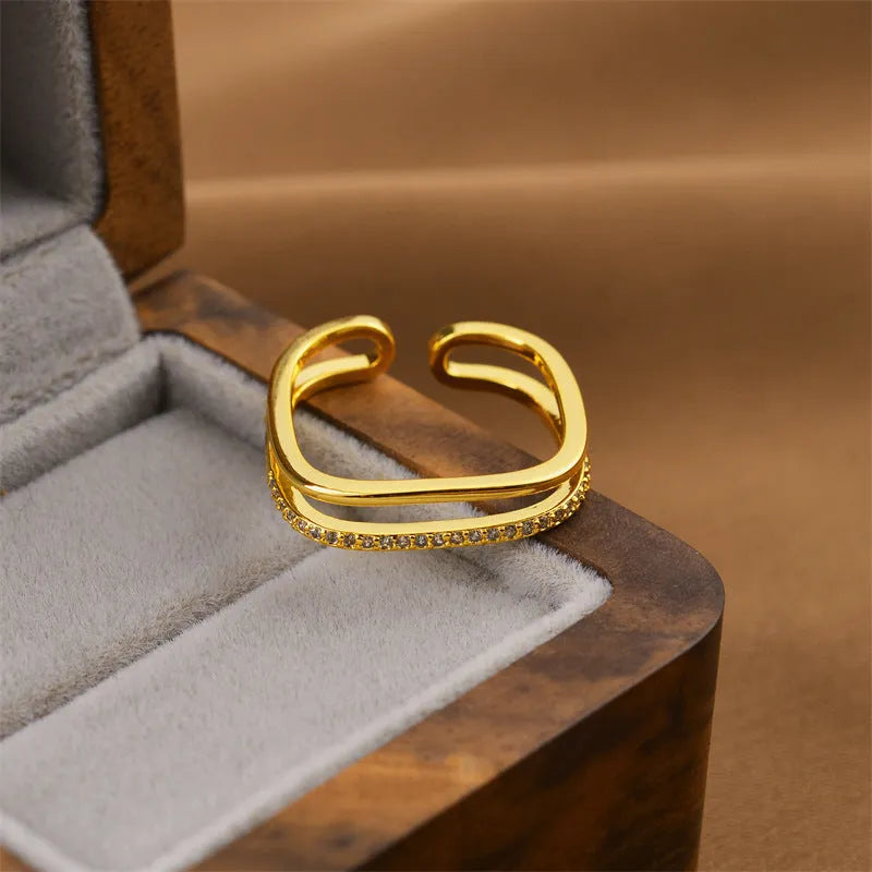 Korean women's adjustable open geometric ring with gold electroplated finish on copper