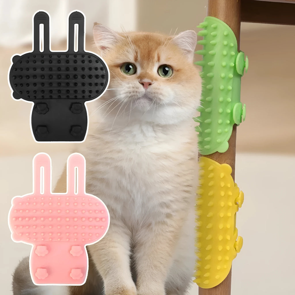 Silicone cat grooming comb with adjustable strap mounted on a table leg, shown in green colour.