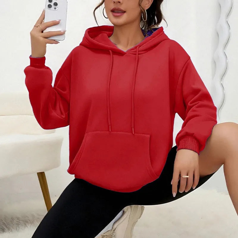 Women's loose fit grey drawstring hood sweatshirt with front pockets, long sleeves