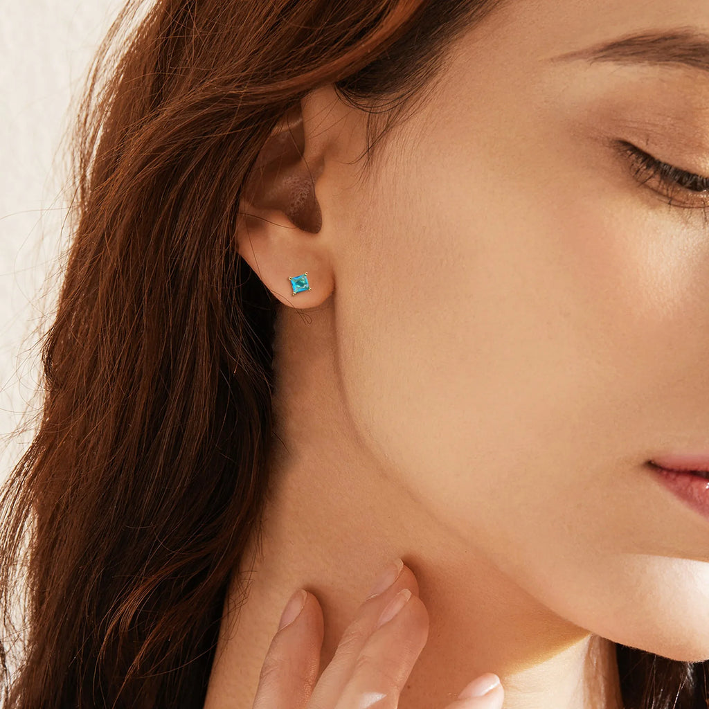 Gold-plated drop earring with a pear-shaped cubic zirconia stone in a candy colour.